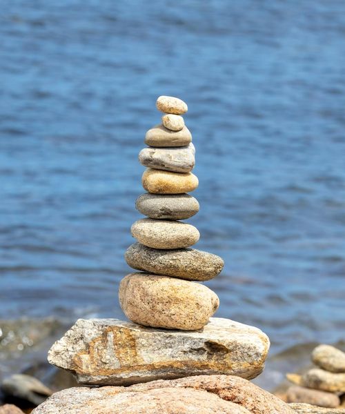 Balanced stones representing the harmony between body and mind.
