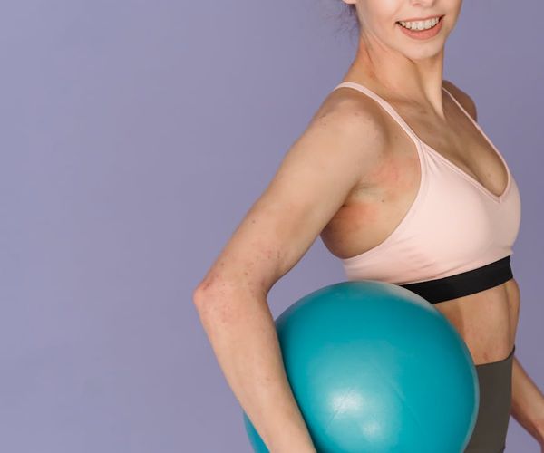 Person in an energetic yoga stance, radiating confidence.